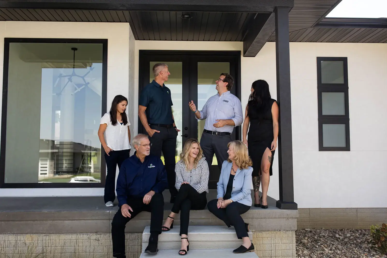 Oakridge Real Estate Team in front of sold home